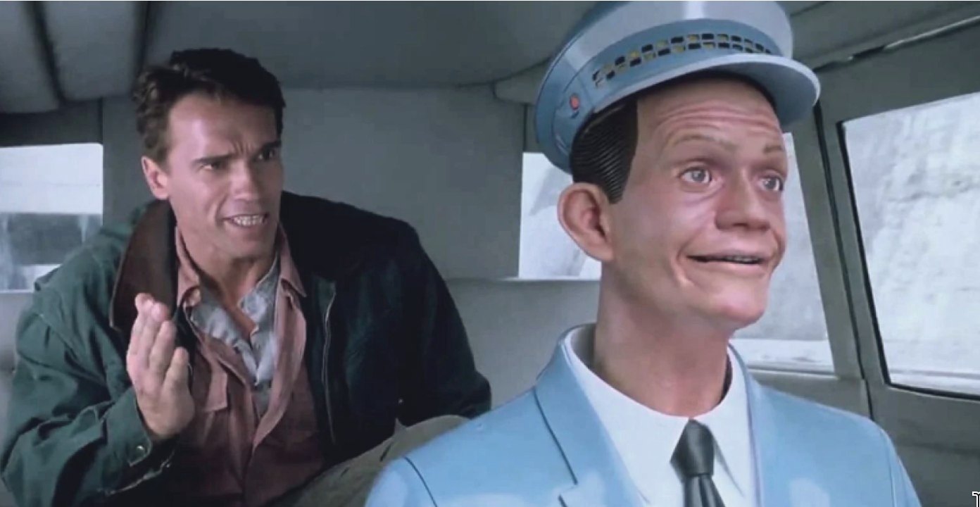 A passenger leans forward from the back seat of a taxi to argue with the driver, who is a smiling plastic mannequin bolted behind the wheel.